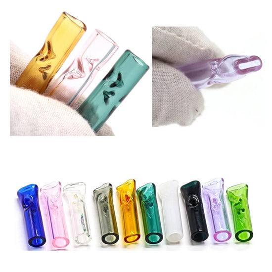 Colourful glass smoking accessories on a white background, whilst being help with gloves