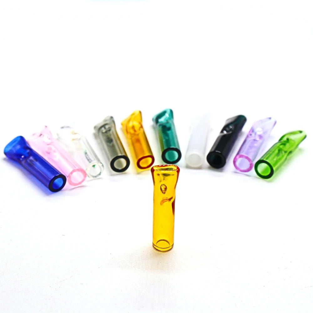 Set of colorful glass smoking tips on a white background, the yellow tip standing up